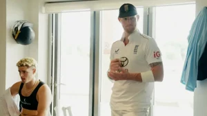 Ben Stokes speaks to England teammates in the dressing room before announcing his Test retirement.