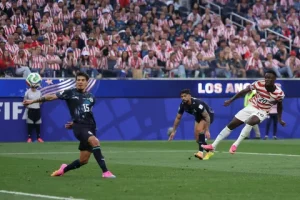Folarin Balogun in USMNT jersey reacting during FIFA World Cup 2026 red card controversy match