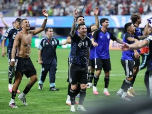 Lionel Messi celebrates after helping Argentina defeat England to reach the FIFA World Cup final.