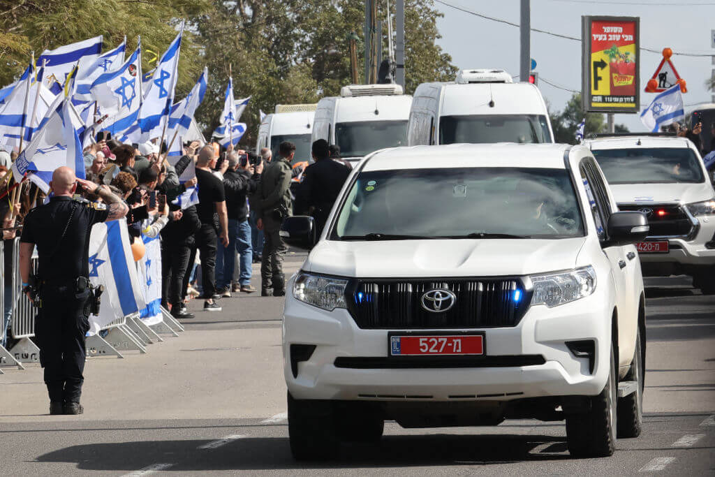 Crowds Cheer as Convoy Carrying Released Israeli Hostages Passes Near Reim Base