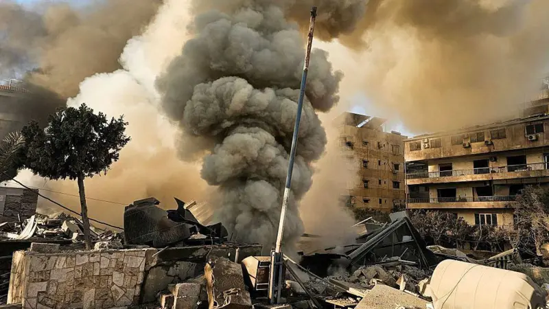 Israeli military strikes hit Tehran and southern Beirut