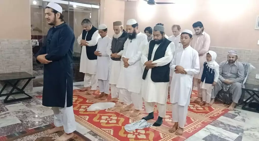 Holy Quran in Taraweeh completion ceremony led by Hafiz Muhammad Butt during Ramadan