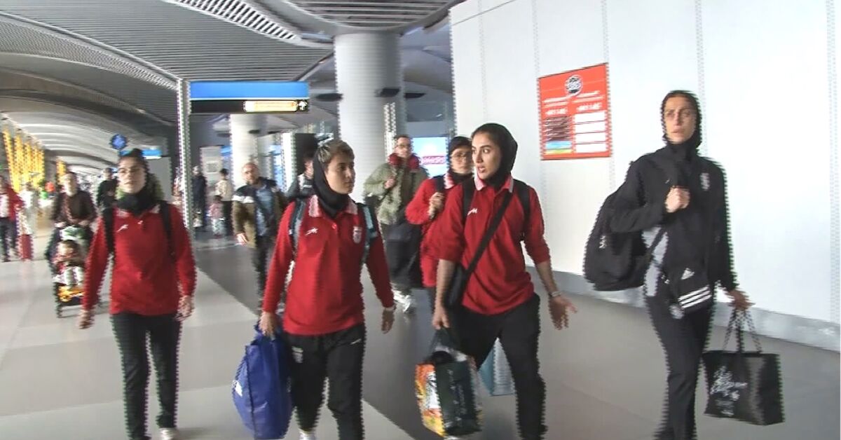 Iran women football team — players in Iranian national tracksuits at Turkish border crossing on journey home after Australian asylum crisis March 2026