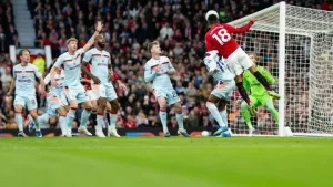 Manchester United FC players celebrating a goal against Brentford at Old Trafford in the Premier League 2025-26 season