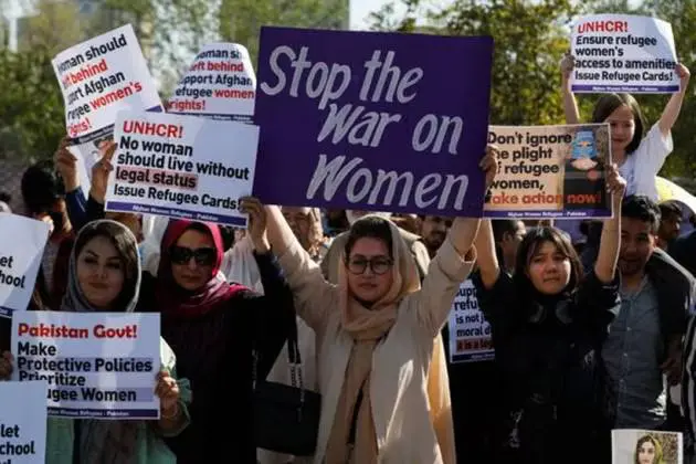 Pakistani women holding signs demanding enforcement of women protection laws Pakistan amid rising gender-based violence