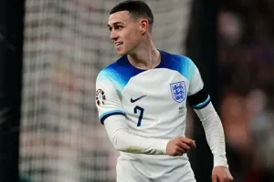 Phil Foden celebrating a goal for Manchester City in the Premier League, showcasing his career goals and assists milestone