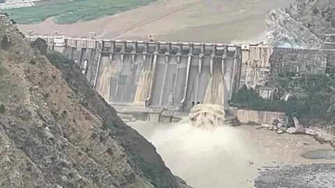 Aerial view of Chenab River floodwaters rising near Marala Barrage, Punjab, Pakistan, May 2026