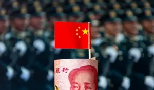 Chinese military personnel march during a national defence display as China increases its defence budget in 2026.