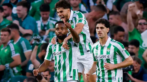 Real Betis players celebrating UEFA Champions League qualification 2026 after defeating Elche at Benito Villamarin Stadium
