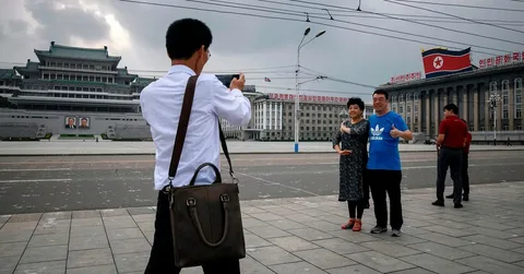 North Korea tourism 2026 Pyongyang skyline with tourists and travel restrictions update