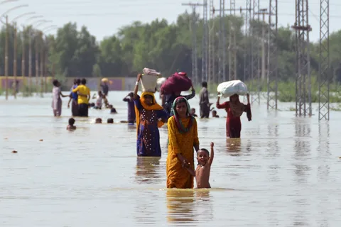 Aerial view of flooded residential areas along the Ravi River in Lahore, Pakistan, August 2025, showing the scale of the flood management dispute and disaster.