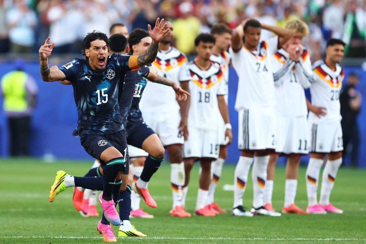 Paraguay players celebrate after defeating Germany in the first penalty shootout of the FIFA World Cup 2026 knockout stage.