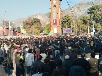 Crowd gathered during Azad Kashmir protest with security presence and disrupted mobile internet services in the region.