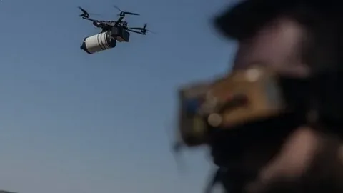 A military FPV drone equipped with fiber optic guidance technology flying during a training exercise amid growing interest in advanced drone warfare.