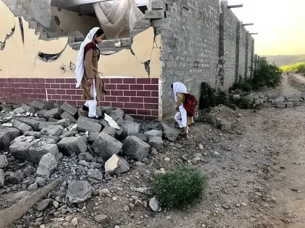 Burnt and damaged school building in rural Pakistan after a security-related explosion in 2022