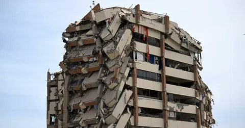 Rescue teams search through collapsed buildings after the Venezuela earthquake as the death toll continues to rise.