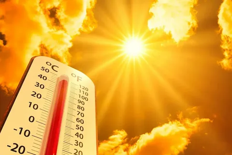 People walking under the scorching sun during the Pakistan Heatwave 2026 as temperatures rise across major cities.