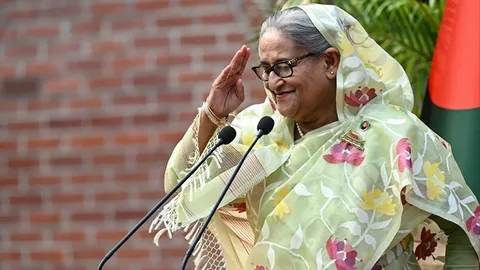 Sheikh Hasina addressing supporters during a political event as discussions continue about her possible return to Bangladesh.