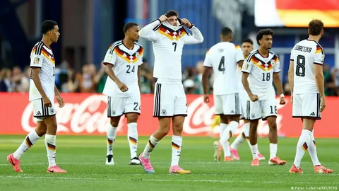 Germany players react after being knocked out of the FIFA World Cup 2026 by Paraguay during the Round of 16 match.
