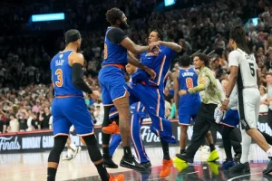 A tense NBA Finals scene showing the New York Knicks narrowly defeating the San Antonio Spurs in Game 2.