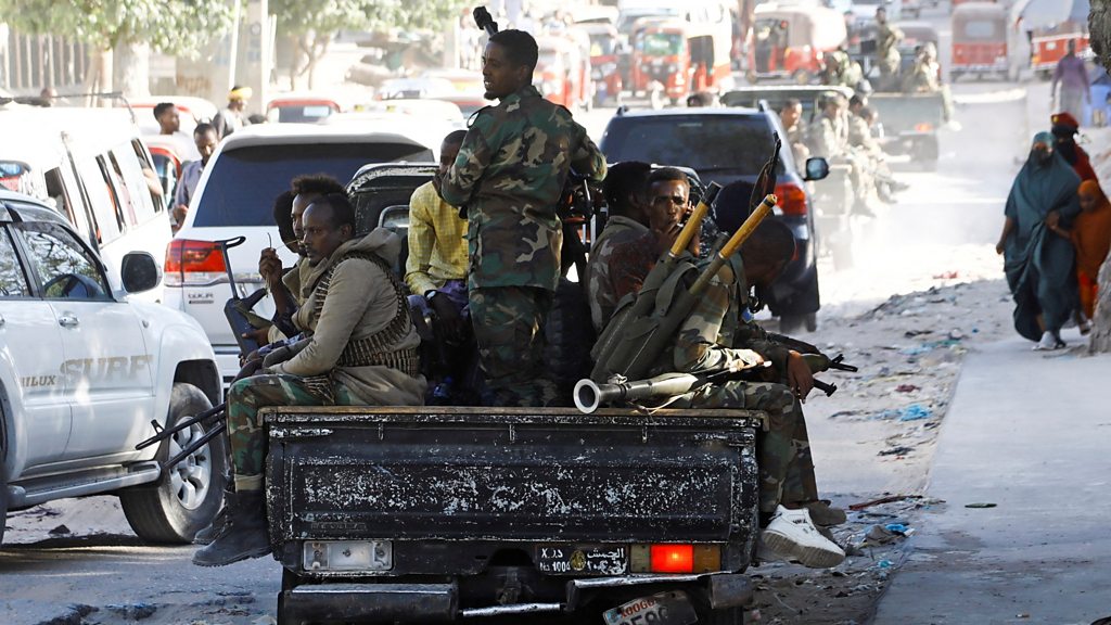 Security personnel patrol a street in Mogadishu amid growing Somalia government tensions and political unrest