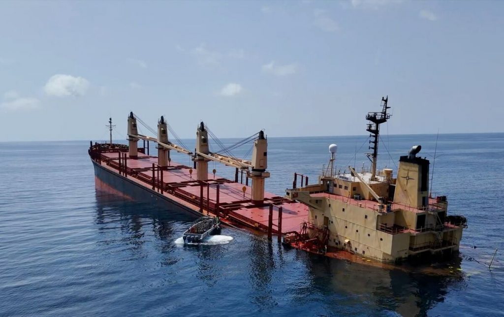Cargo ships sail through the Red Sea as Houthi attacks disrupt maritime traffic and push global oil prices above $100 a barrel.