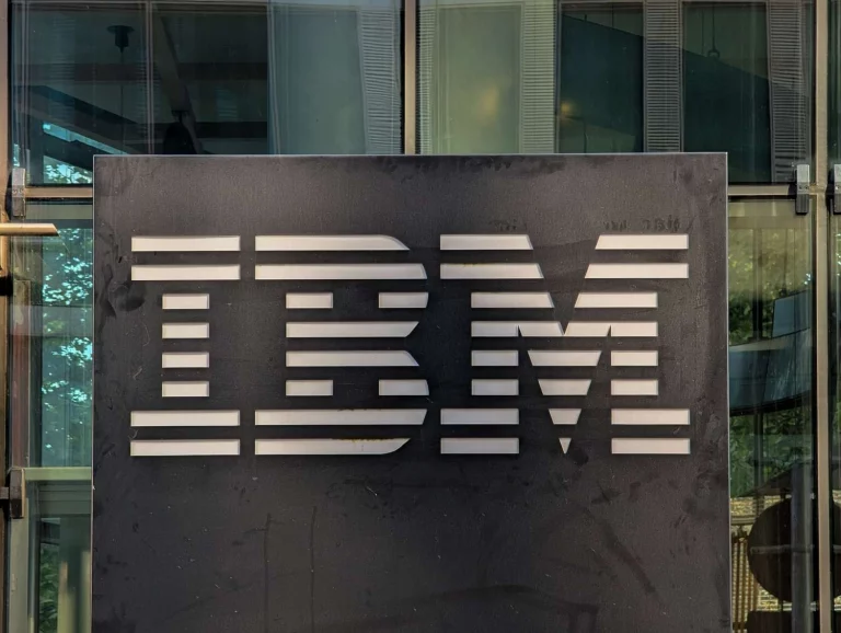IBM logo displayed with stock market charts highlighting a sharp decline in share price after earnings.
