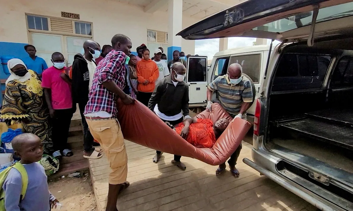 Health workers in protective gear treating patients at an Ebola treatment center in Ituri Province, DR Congo, during the 2026 Bundibugyo virus outbreak.