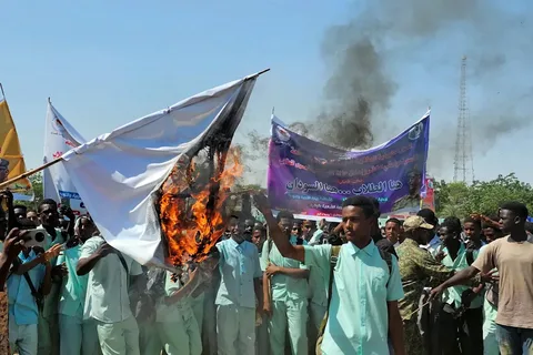 Displaced Sudanese families fleeing drone strikes during the Sudan war siege of El Obeid