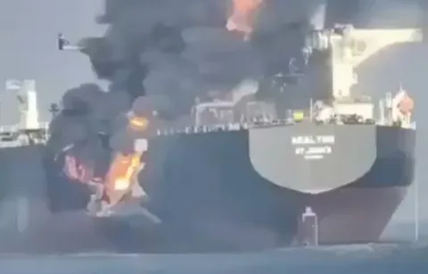 Oil tanker engulfed in flames after a projectile strike in the Strait of Hormuz near Oman's coast
