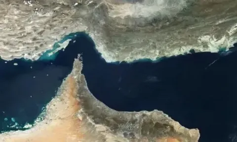 Cargo ships and oil tankers anchored near the Strait of Hormuz amid ongoing US-Iran conflict