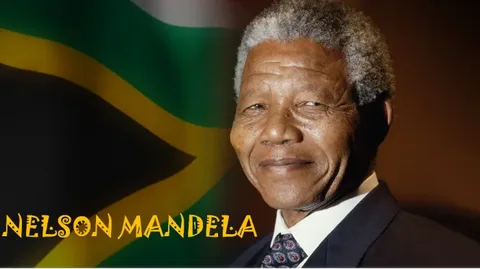 Nelson Mandela raising his fist in a crowd, symbolizing freedom, equality, and the end of apartheid in South Africa