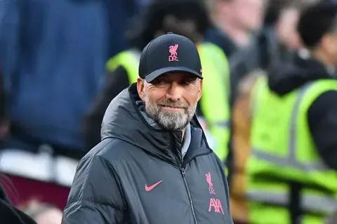 Jürgen Klopp smiling and raising his fist in celebration after being appointed as Germany national team head coach in July 2026