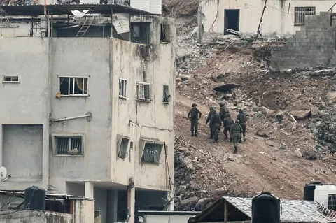 Security forces operate during a deadly West Bank raid amid the ongoing Israel-Palestine conflict.