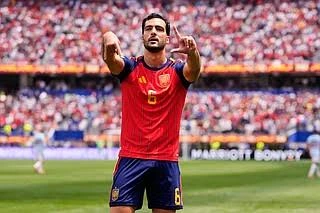 Mikel Merino celebrates after scoring Spain's winning goal against Belgium in the FIFA World Cup quarter-final.