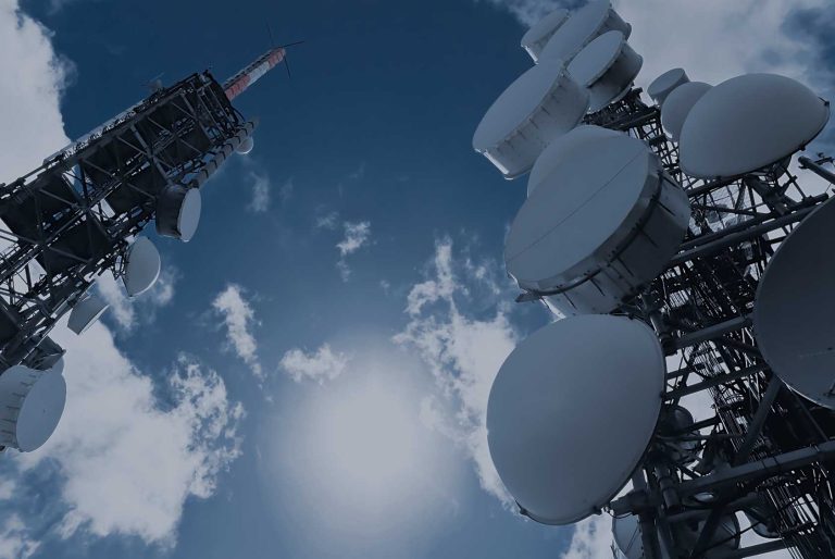 Telecom tower against a Pakistani skyline representing G2G agreements in the IT sector