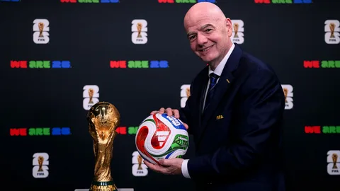 FIFA President Gianni Infantino holding the World Cup trophy at the 2026 FIFA World Cup final in New Jersey