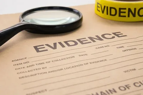 A forensic scientist in protective gloves examining crime scene evidence at a laboratory table, representing human error in forensic science and CSI investigations