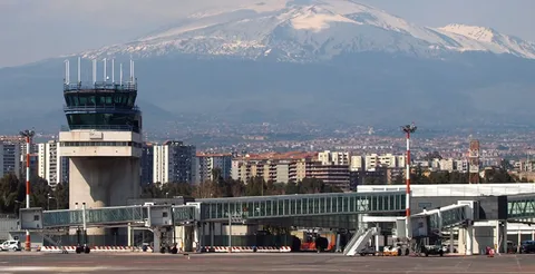 Ash plume rising from Mount Etna volcano near Catania Airport in Sicily, Italy