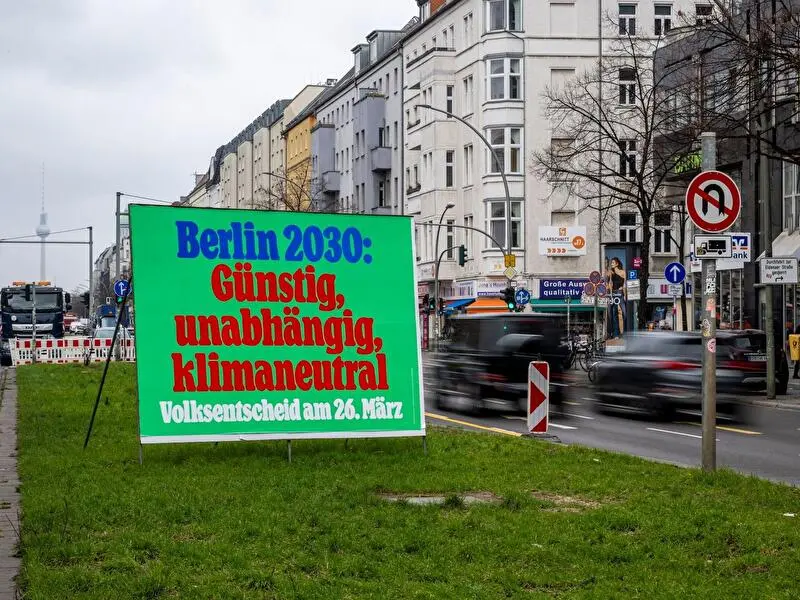 Germany climate reforms 2026 wind turbines and solar panels under grey sky