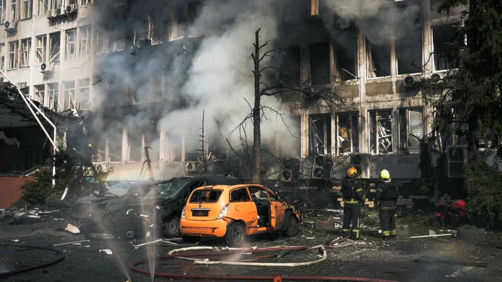 Rescue workers extinguish a fire after a Russian drone strike hit a market in Zaporizhzhia, Ukraine