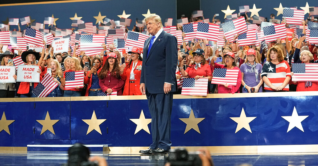 Donald Trump speaking at a podium during the Republican Party midterm convention in Dallas