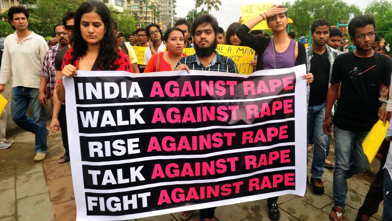 Protesters holding placards at a women's safety march in New Delhi, India