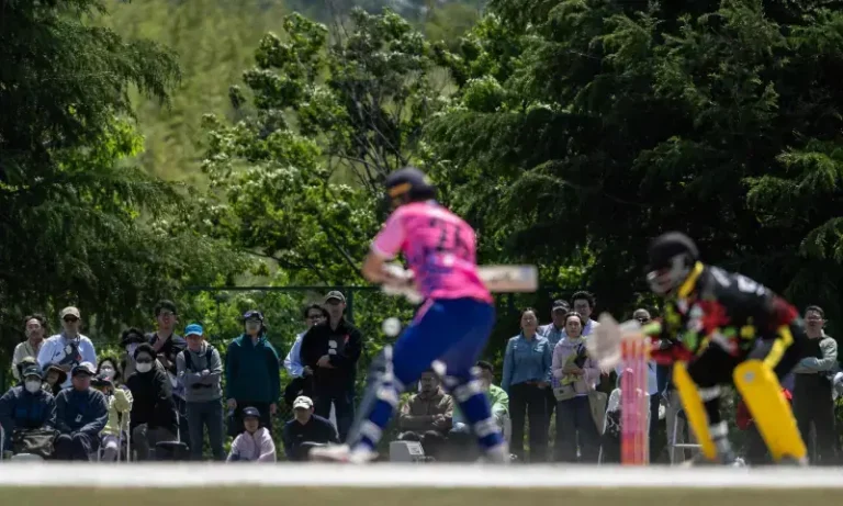 Japanese cricket team players training on a repurposed baseball ground ahead of a diplomatic cricket match against India