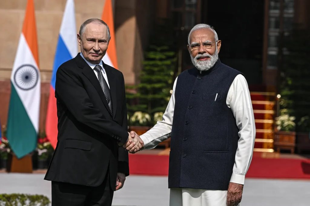 India Russia sanctions news — flags of India, Russia and the United States with an oil tanker in the background