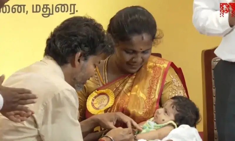 Tamil Nadu newborn gold scheme: Chief Minister Vijay presents a one-gram gold ring to a baby at Government Rajaji Hospital, Madurai