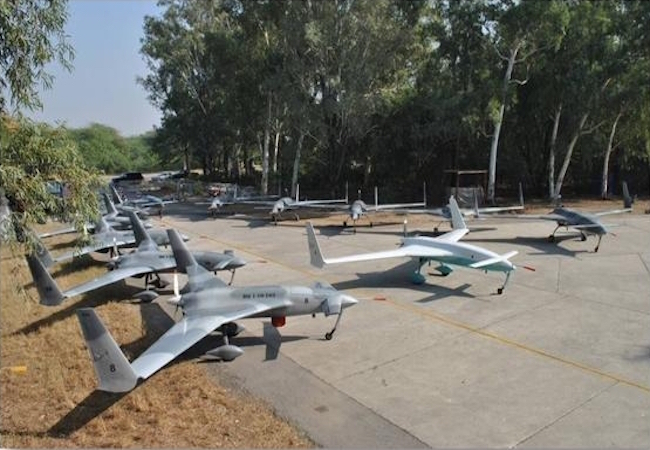 Powerus Pakistan Army MoU signing ceremony showing a military drone against an Islamabad skyline backdrop