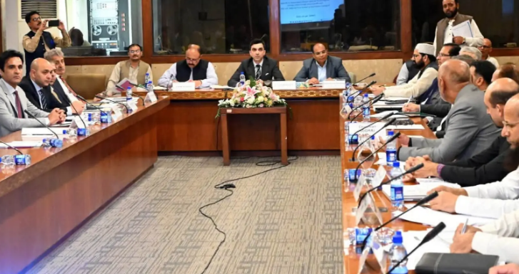 PPP leader Naveed Qamar speaks to reporters in Islamabad after PPP blocks gas revenue bills in parliament