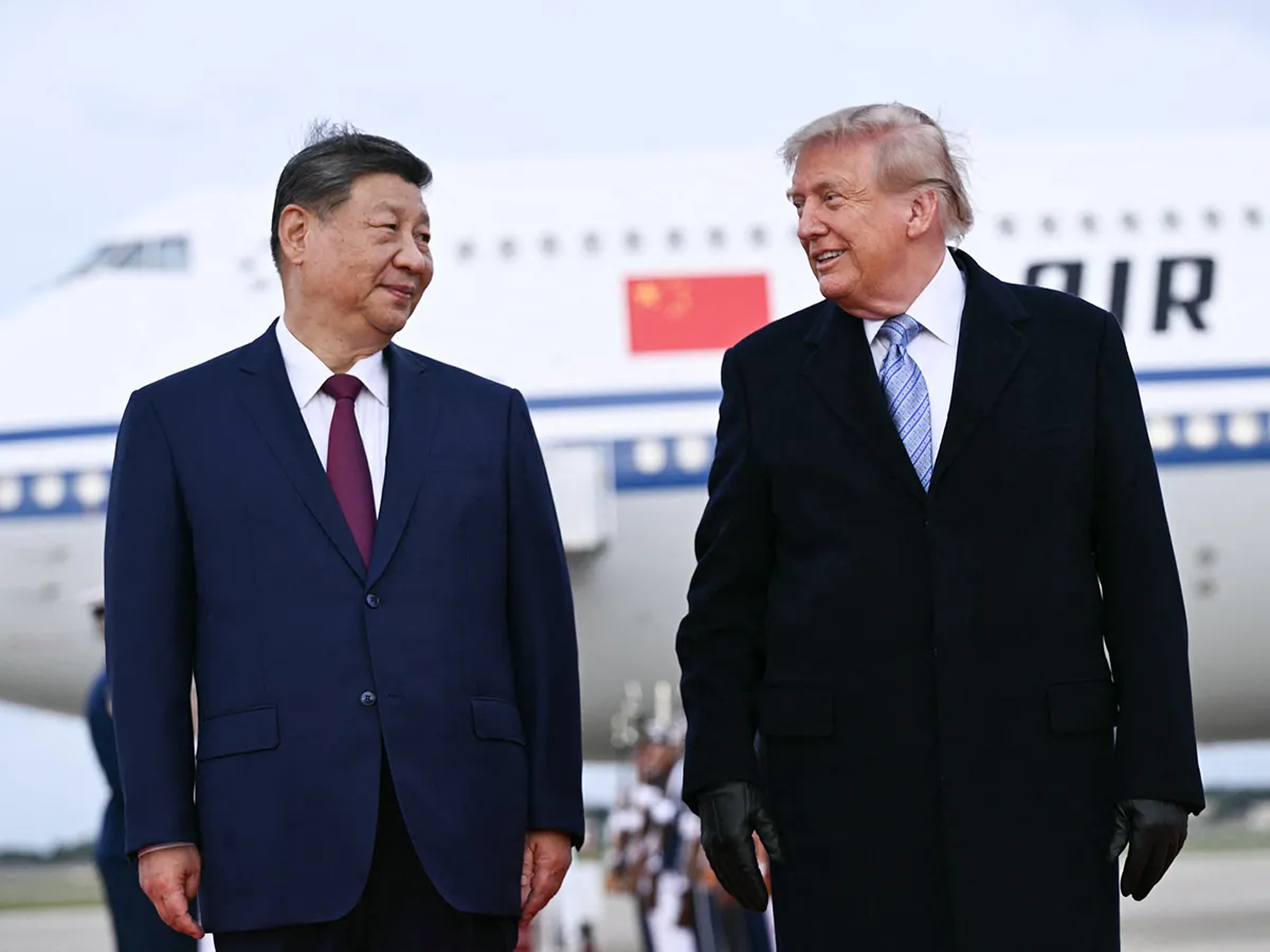 Donald Trump and Xi Jinping shake hands at Joint Base Andrews during 2026 US-China trade truce summit