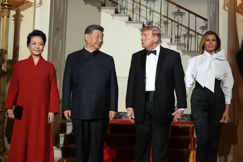 Donald Trump and Xi Jinping standing together during their Washington summit visit to the US National Archives